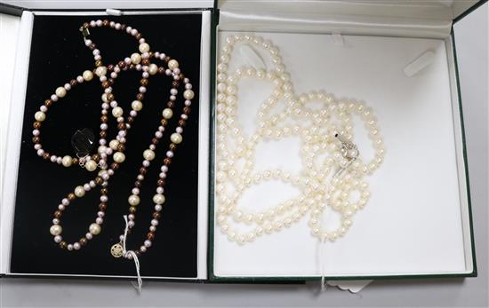 A triple strand cultured pearl necklace with silver clasp. A double row South Sea cultured pearl necklace, 51cm